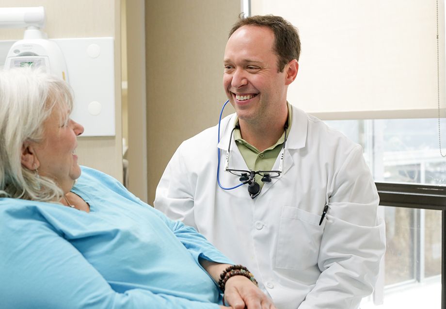 Dr. Robison smiling at patient