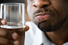 Man rinsing his mouth with salt water